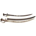 An Indian sword Tulwar, curved blade 30”, iron hilt with knucklebow and disc pommel of traditional