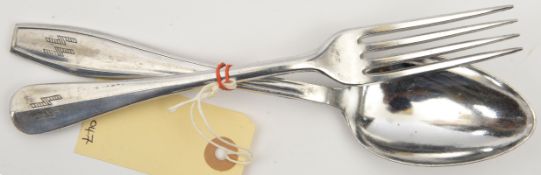 A Third Reich aluminium dessert spoon, and a fork of slightly different design, each marked “