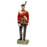 A “Kingsman Collection” painted porcelain figure “Officer K.O.S.B, c 1912” standing at ease, in full