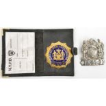 A City of New York Police Lieutenant’s enamelled gilt badge,with blank identity card in matching