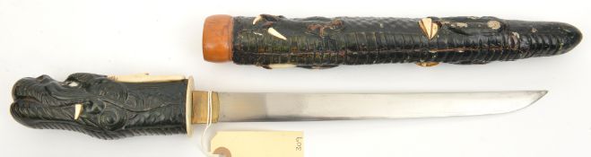 A Japanese tanto, untempered blade 9½”, mounts in the form of a dragon lacquered with ivory details,