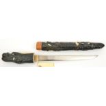 A Japanese tanto, untempered blade 9½”, mounts in the form of a dragon lacquered with ivory details,