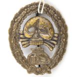 A Third Reich period Condor Legion Panzer assault badge, of flat die struck tombak with traces of