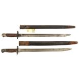 2 P1907 bayonets, various stamps at forte, in scabbards (some rust to mounts). GC