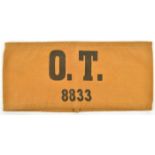 A scarce Third Reich Organisation Todt armband, of pale brown linen, printed in black “OT” over “