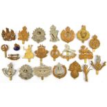 21 different cap badges, including Geo VI RE, Welsh Gds, Kings Gothic title, Beds & Herts (2),
