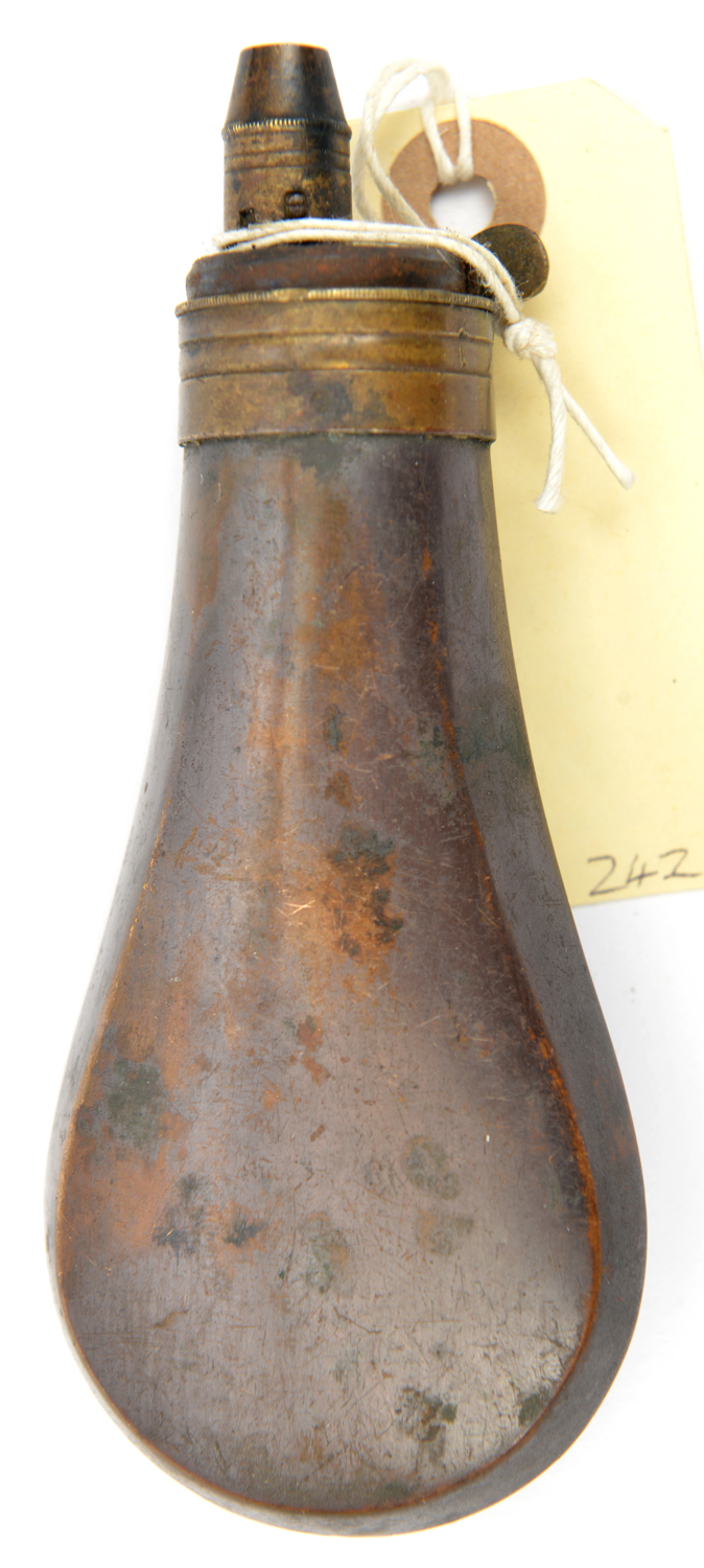 A plain pistol size copper powder flask, 4¾”, with patent top. GO & C, retaining some original