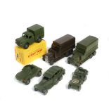 8 Dinky Toys. Army 1 Ton Cargo Truck (641), boxed. Scout Car (673). Jeep (153a). 2 x 6-wheel Covered
