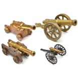 A model cannon, brass barrel 6½” of good shape, on its 4 wheeled cast iron naval type carriage,