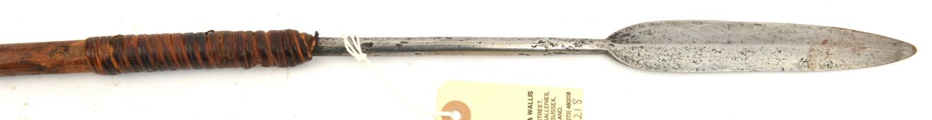 A Zulu throwing spear, 57”, slender leaf shaped blade 6”, rattan binding. GC