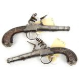 A pair of silver mounted 50 bore cannon barrelled flintlock boxlock pocket pistols, by (John)