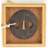 A Japanese tsuba, signed Bushu Zu Masayoshi, waves in design. In a case, GC