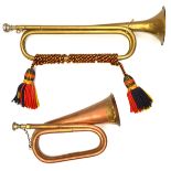 A brass trumpet, by Barretts, bound with red, yellow and black cords and tassels (slightly