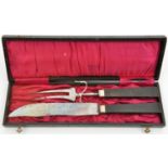 A Third Reich officer’s mess carving set, the knife blade stamped “Curdts Nache Solingen”, the