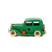 Tri-ang Minic £100 Ford saloon (1M). A pre-war example in green with white tyres and petrol can to