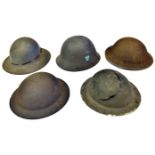 2 WWII British steel helmets with rough textured finish, one olive green, the other dark brown;