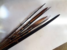 A Polynesian darkwood bow, 68”, and 6 various bamboo arrows, average 62”, 3 with long dark