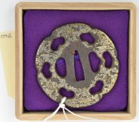 A Japanese tsuba, shoami, mid to late Edo period, silver overlaid GC (some wear,) in a case. GC