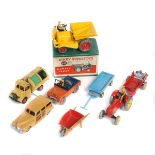 10 Dinky Toys. Dump Truck (562) in deep yellow with red centred wheels in early green paper, red/