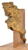 A small gilded model of a ship’s crowned lion figurehead, 8”, on a wooden base. GC