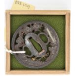 A Japanese tsuba, chiselled with fisherman inlaid with shakudo silver and copper gilt. GC in a case.