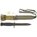 A post WWII military knife, probably US, blade 6¾”, DE at point, composition hilt, in its fibre