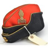 An ERII officer’s sidecap of The R Artillery, scarlet and blue cloth, gilt trim, embroidered