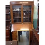 AN OAK LEADED GLASS BUREAU BOOKCASE H206CM W107CM D47CM