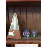 METRONOME AND TWO GLASS PAPERWEIGHTS