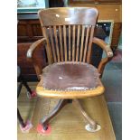 A BEECH SWIVEL OFFICE CHAIR ON CASTORS