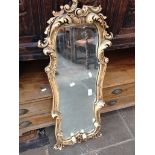 A SMALL ORNATE FRAMED MIRROR 90X35CM