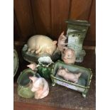 FIVE PORCELAIN PIG ORNAMENTS