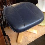 A NAVY BLUE LEATHER FOOT STOOL