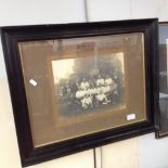A FRAMED PHOTOGRAPH OF THE WELLINGBOROUGH NOMADS FOOTBALL TEAM 1921-22
