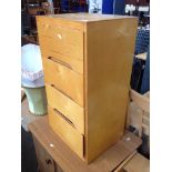 A RETRO PLYWOOD CHEST OF FOUR DRAWERS