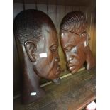 TWO CARVED AFRICAN HEAD PLAQUES