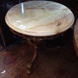 AN ONYX AND BRASS EFFECT ROUND TABLE
