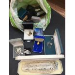 A BAG OF BOXED COSTUME JEWELLERY C