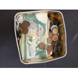 A TIN OF COINS AND NOTES C