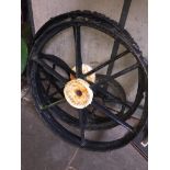 2 CAST IRON TRACTOR/WAGON WHEELS (6 SPOKE) AND 2 SMALL CAST IRON WHEELS