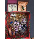 A TARTAN BOX OF COSTUME JEWELLERY C