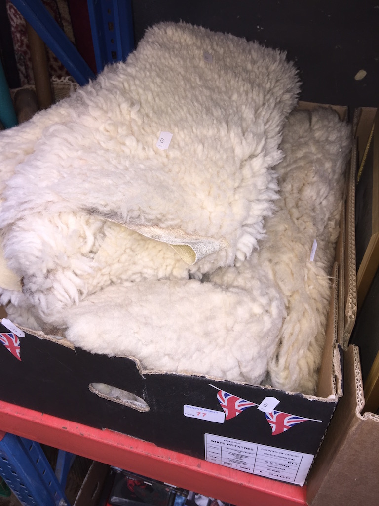 BOX OF SHEEPSKIN RUGS