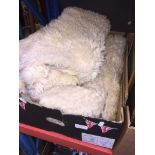 BOX OF SHEEPSKIN RUGS