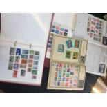 AN ALBUM AND 2 FOLDERS OF STAMPS