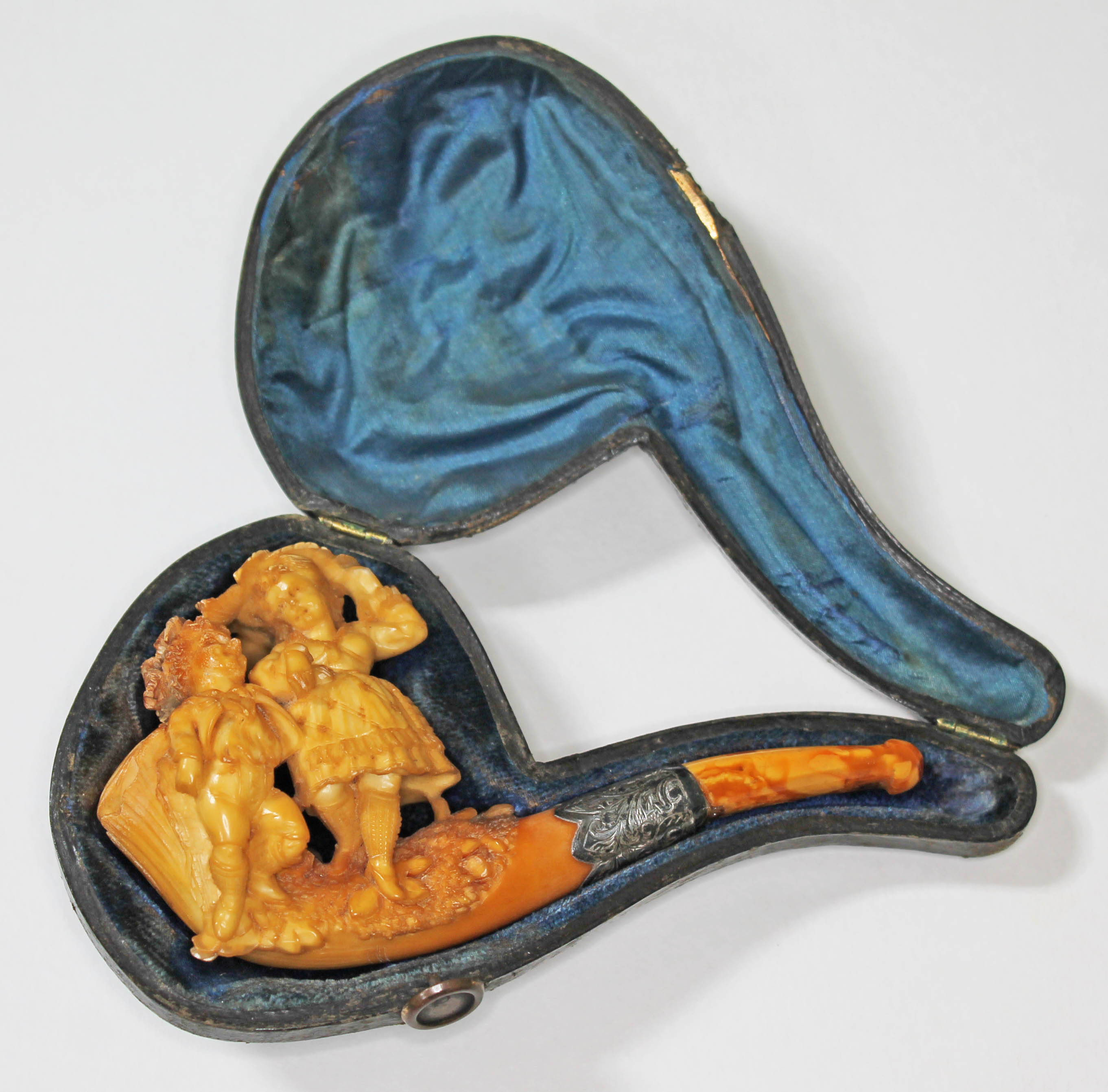 A silver mounted meerschaum pipe with butterscotch amber mouthpiece.