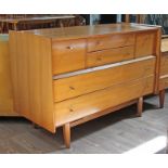 A 1960s chest of drawers with turned spindle drawer pulls and spindle legs by Younger, length 121.