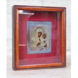 A Russian silver icon depicting Madonna and Child, 9cm x 11cm, glazed and framed 21cm x 18.5cm.