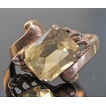 A hallmarked 9ct gold ring set with a citrine colour stone, gross wt. 3g, size L.
