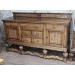 A carved oak sideboard circa 1920, length 193cm, depth 60cm & height 112cm.