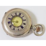 A hallmarked silver half hunter pocket watch, the dial inscribed 'Robert Milne Manchester', diam.